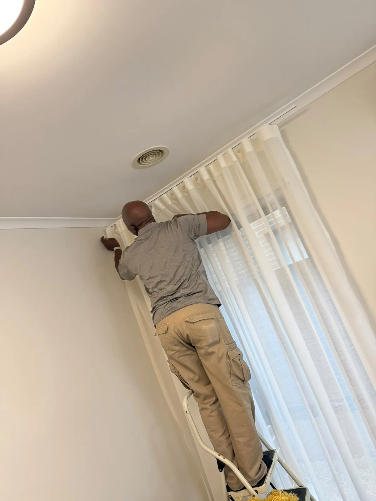 Fitting curtains in a customer room